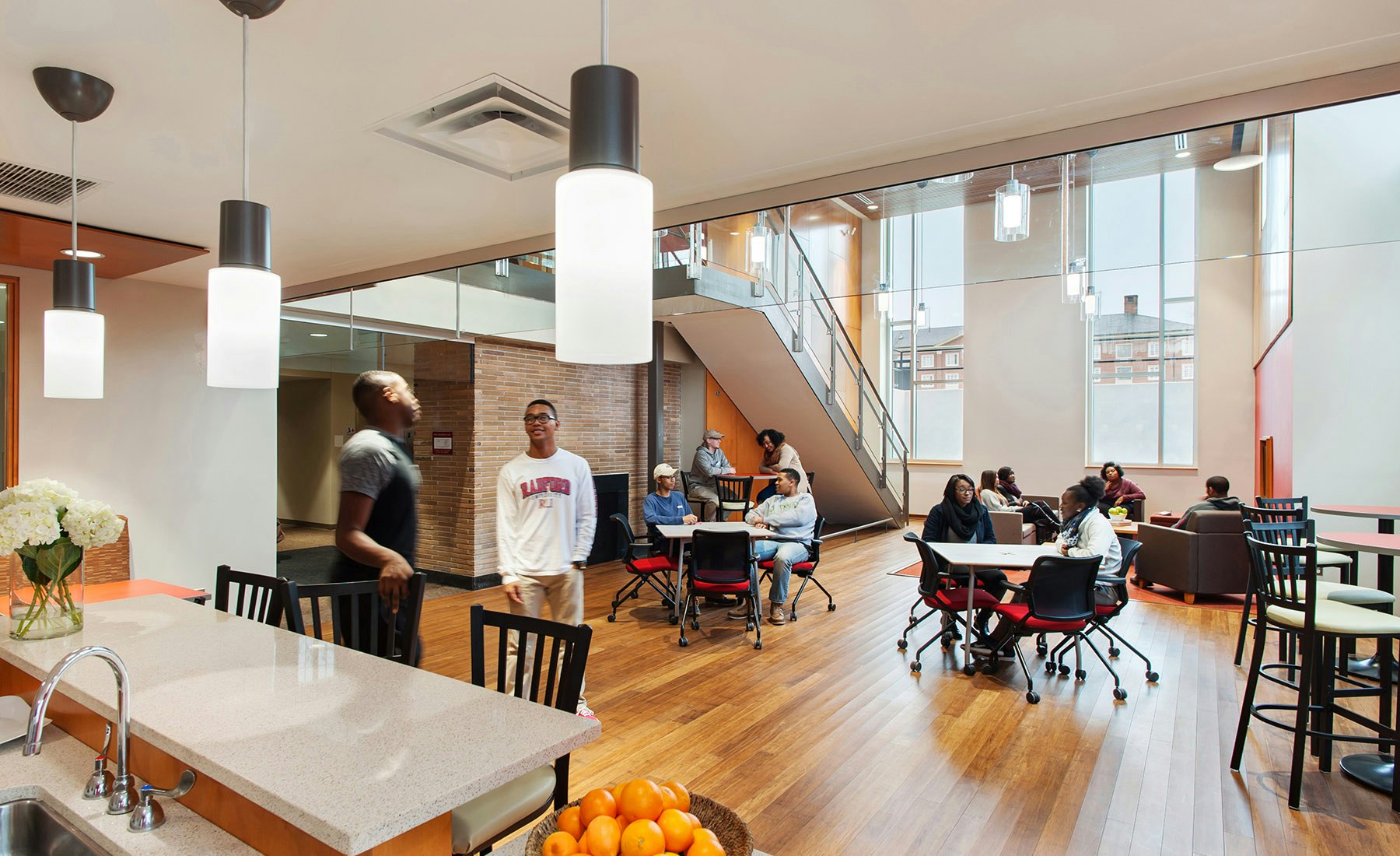 By removing an existing floor, VMDO designed a new two-story lounge space at the north end of each building. The new commons creates a remarkably open gathering space that is at once open and light-filled as well as private and removed.